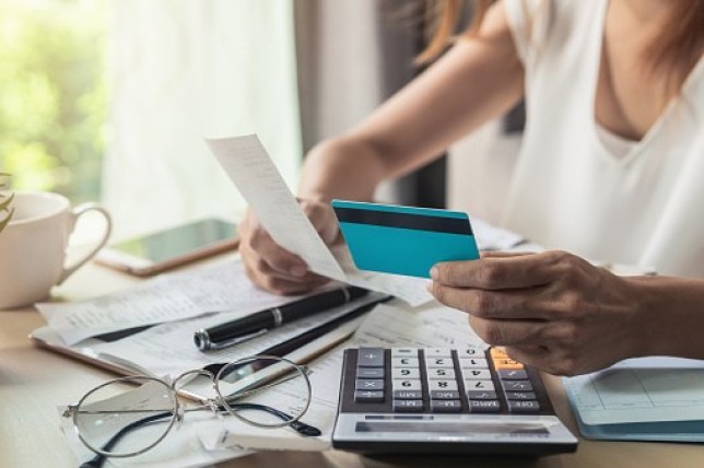 Image of women paying bills