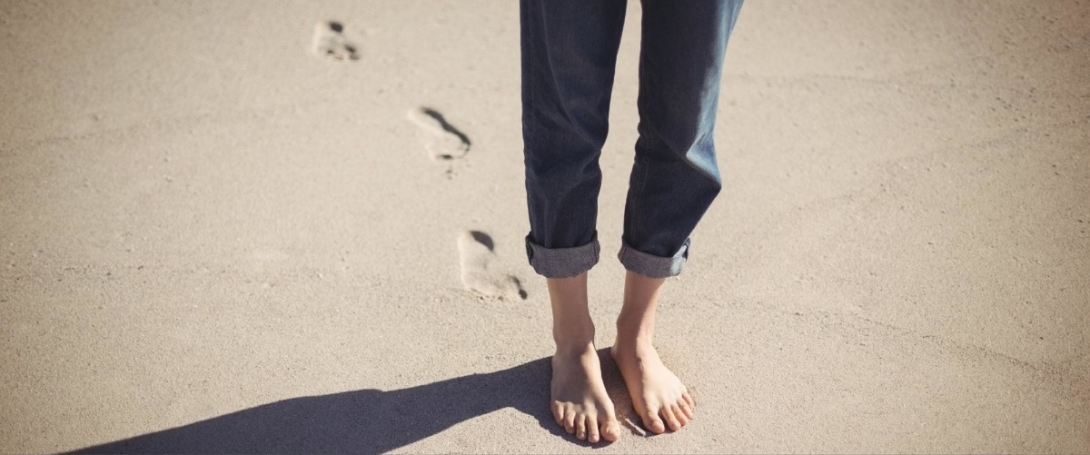womens footprints in sand