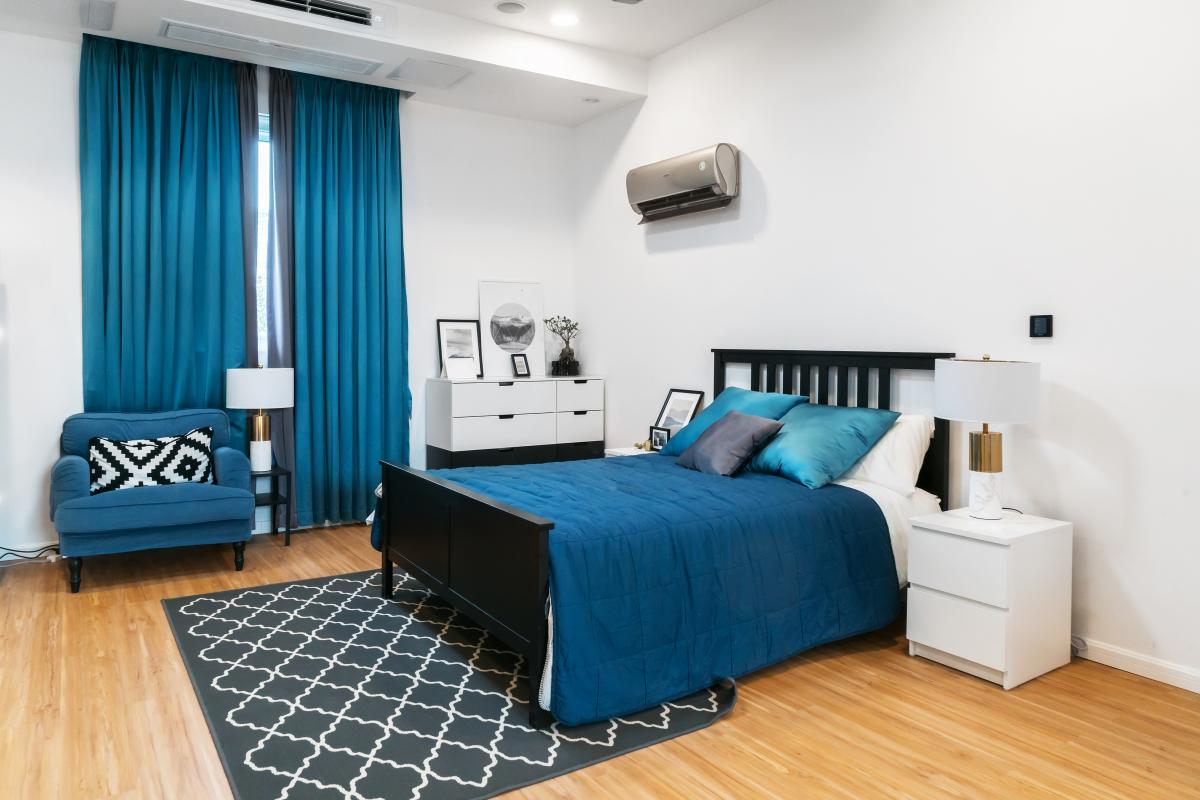 bedroom modern blue decor with wall ac unit