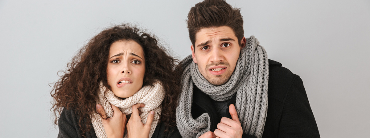 frozen young couple wearing sweaters scarfs standing 