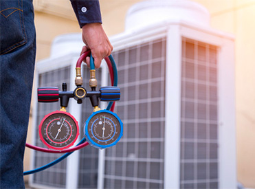 HVAC Replacement Guide Man holding Gauge