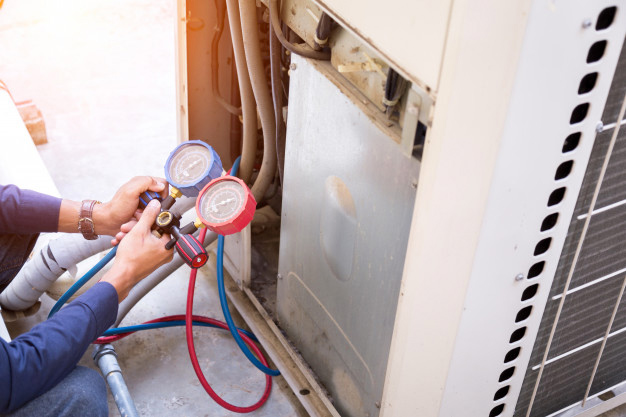 man-checking-furnace pressure.jpg