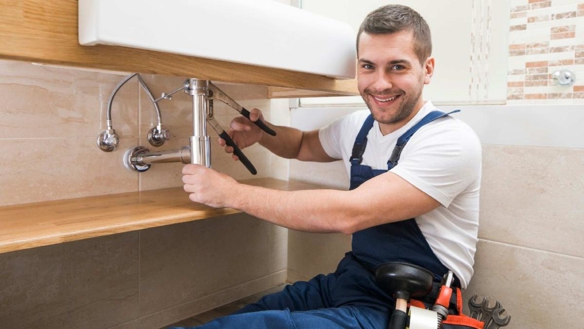 plumber repairing in Denver home
