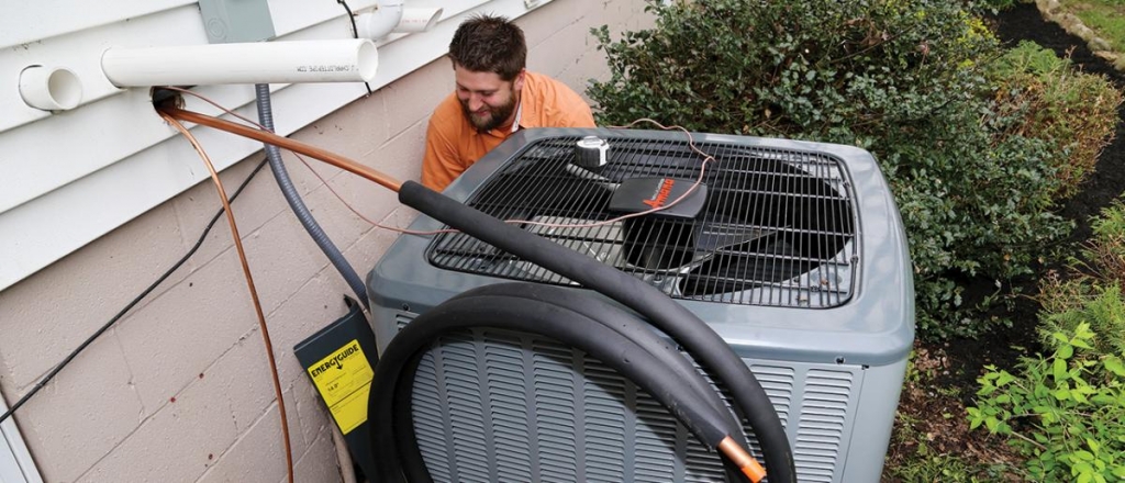 amana air conditioner service man doing annual tune up