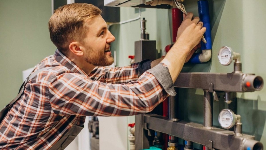 Westminster service tech repairing furnace