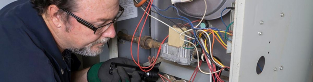 man performing a denver furnace repair