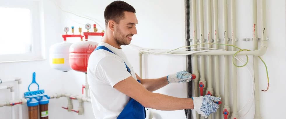 service man working on boiler system