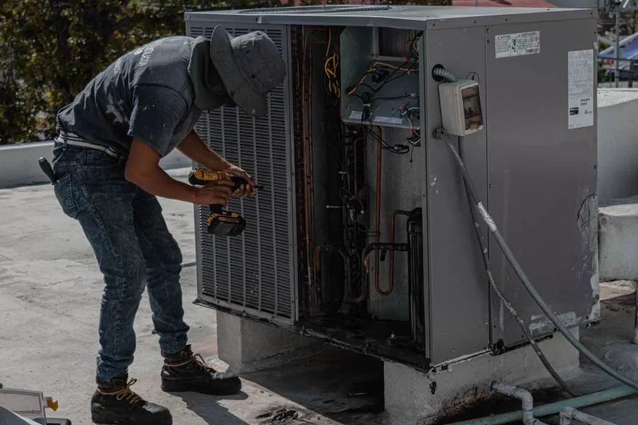 well-maintained AC unit service tech