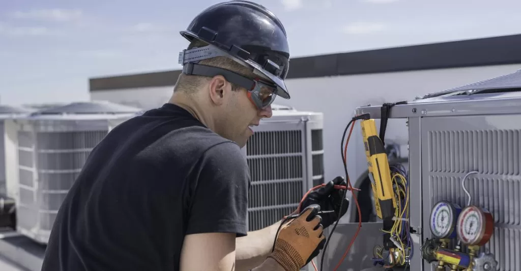 professional HVAC technician fixing HVAC problem