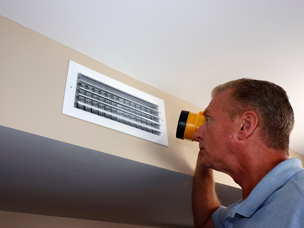 Furnace Will Not Blow Hot Air: Complete Troubleshooting Guide for Homeowners 3 Furnace Will Not Blow Hot Air: Complete Troubleshooting Guide for Homeowners a man troubleshooting a furnace that is not blowing hot air