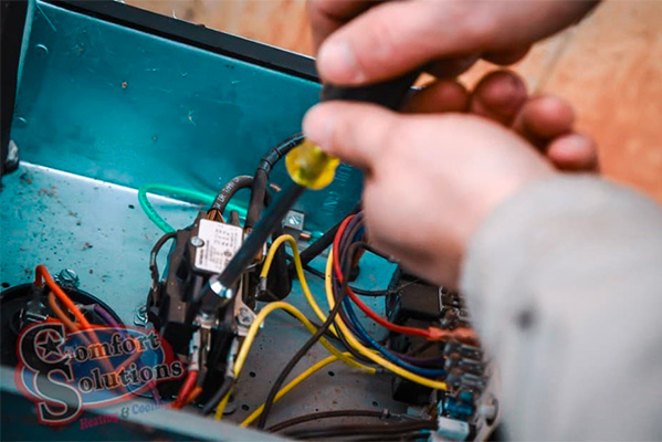 Couple warming hands on candles